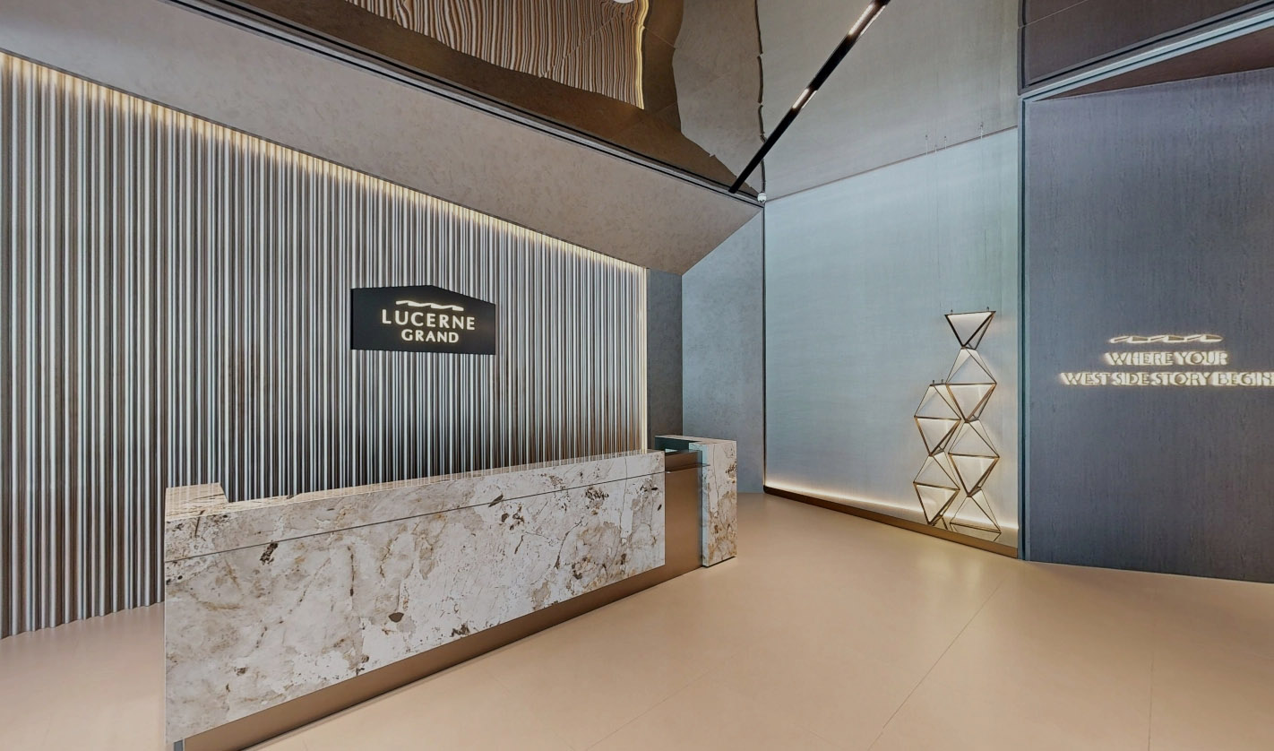Elegant Lucerne Grand reception lobby with marble desk and contemporary feature lighting