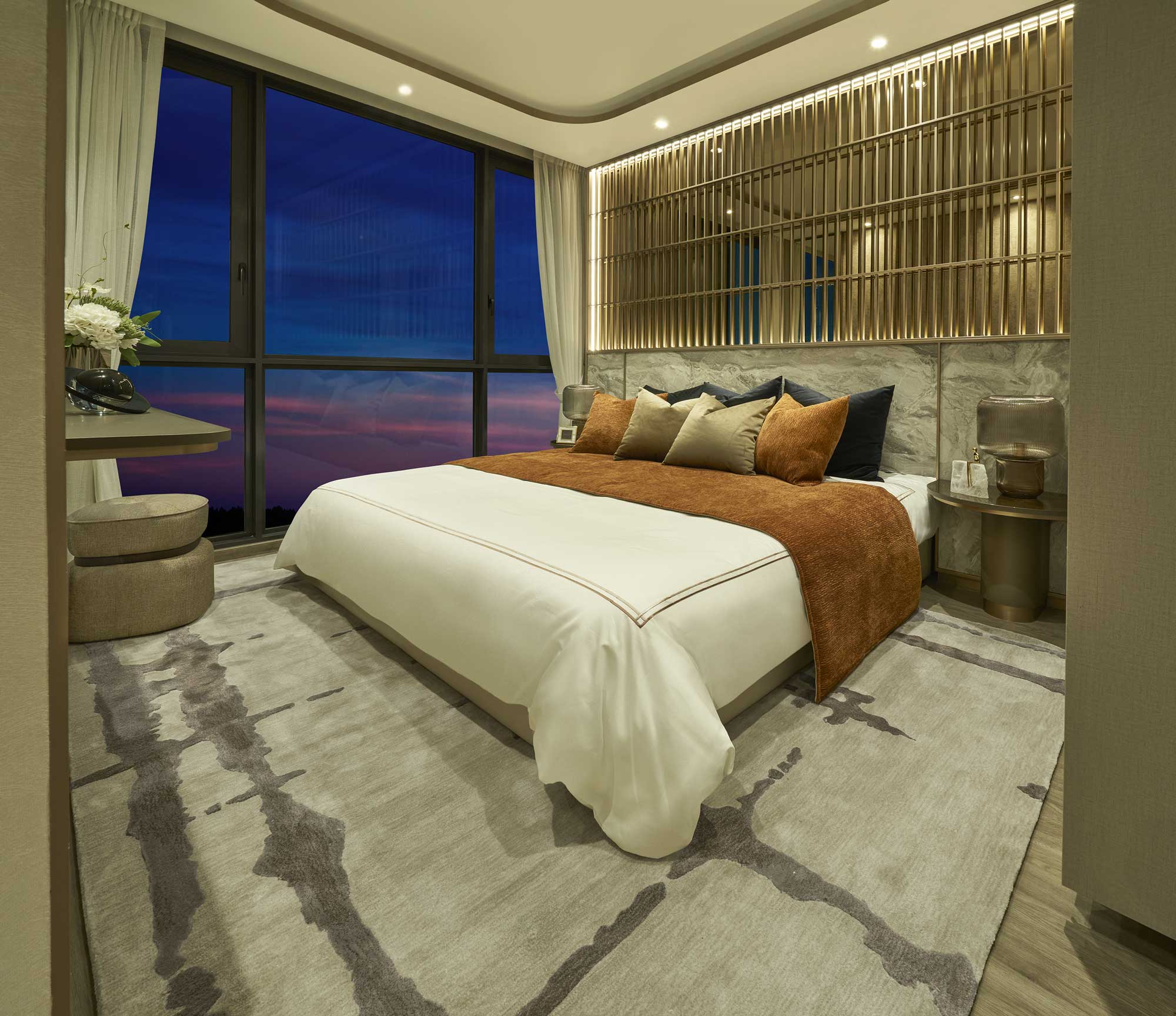 Luxurious bedroom with modern furnishings and warm lighting